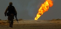 Soldier in burning oil field