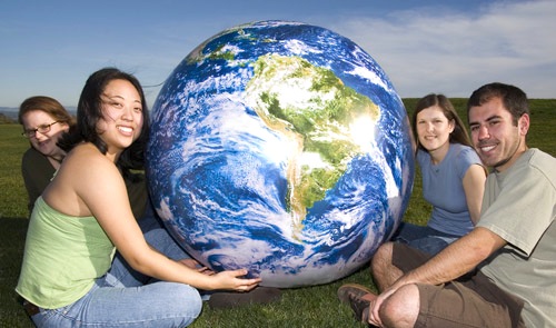 ENVS undergrads holding a globe